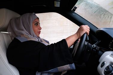 A Saudi woman drives along a street in the Saudi coastal city of Jeddah. Empowering women in the kingdom will have huge economic benefits.. Reem Baeshen/AFP