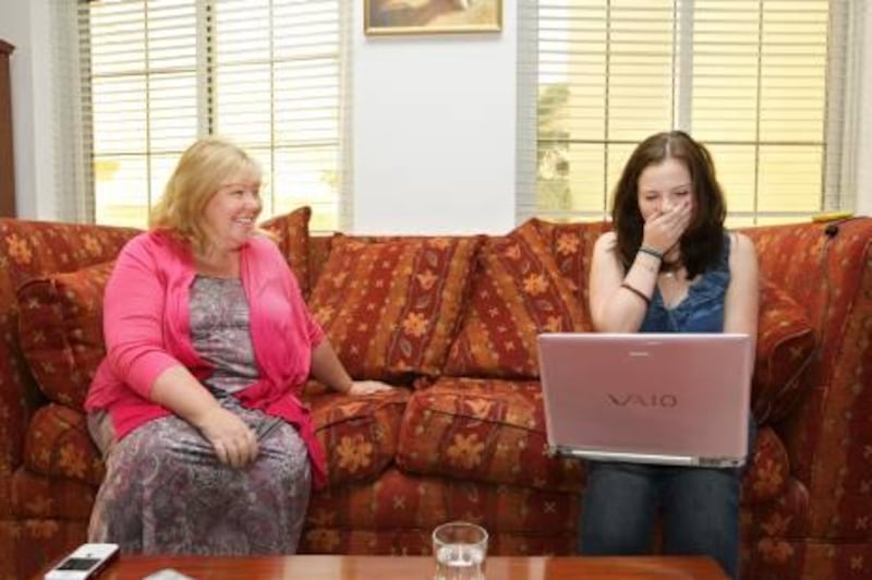 UAE - Dubai - Aug 25 - 2011: A GCSE student, Niamh Merrigan,receive her result online beside her mother Donna Merigan at their house in Umm Suqeim.  ( Jaime Puebla - The National Newspaper )
