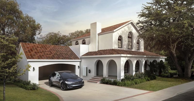 A house with Tesla's new terracotta solar roof tiles. Customers worldwide can now order a solar roof on Tesla's website. The solar tiles contain photovoltaic cells that are invisible from the street. Courtesy Tesla