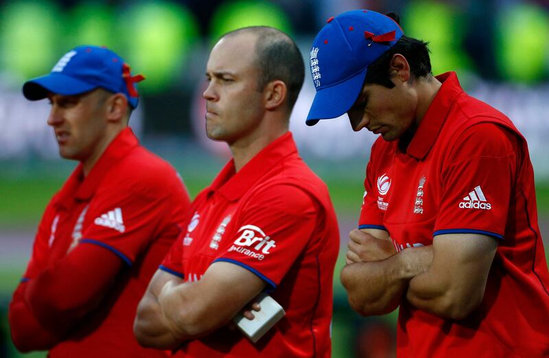 England's Alastair Cook (R) reacts after losing to India in the ICC Champions Trophy final match at Edgbaston cricket ground in Birmingham, central England, June 23, 2013. REUTERS/Darren Staples   (BRITAIN - Tags: SPORT CRICKET) *** Local Caption ***  DST26_CRICKET-CHAMP_0623_11.JPG