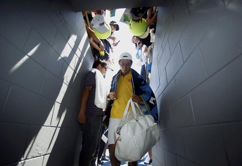 Kei Nishikori of Japan leaves after defeating Marinko Matosevic of Australia. Jason Reed / Reuters