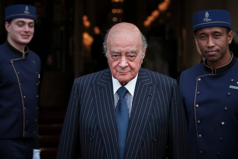 Mohamed Al-Fayed with his hotel staff in Paris.  AP