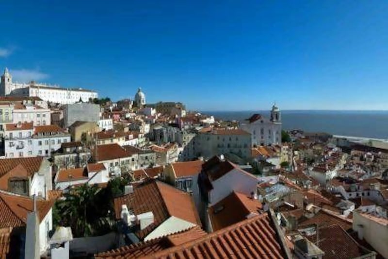 Lisbon's Alfama neighbourhood is a ramble of stepped cobbled alleys and terracotta roofs that shows what the city would have been like before a earthquakes levelled it in 1755. Getty Images