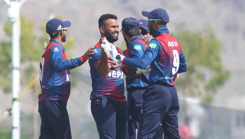 Nepal players celebrate a wicket against UAE.