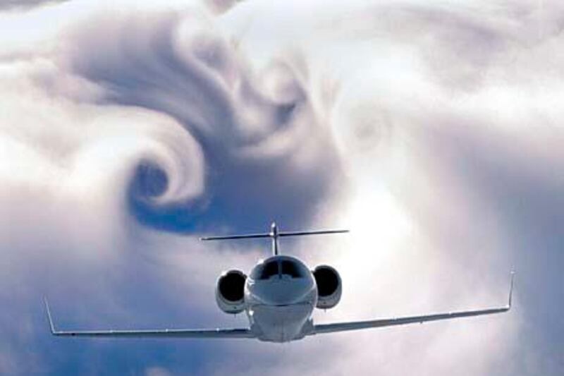 Original caption: In a brilliant display of wingtip vortices, a corporate jet skims above the top of a dense cloud layer. The swirling clouds are created by the air flowing from below the wing, out around the edge to the top of the wing in a circular motion. This dramaticaory Mod. Dis. Date App. Date --- Image by © Paul Bowen/Science Faction/Corbis