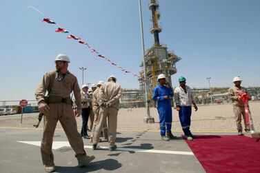 Security personnel guard Exxon's staff of the West Qurna-1 oilfield. Reuters