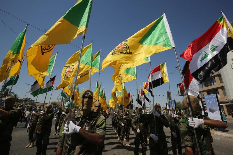 (FILES) In this file photo taken on May 31, 2019 Iraqi Shiite fighters from the Iran-backed armed group, Hezbollah brigades, march during a military parade marking Al-Quds (Jerusalem) International Day in Baghdad,. The US bombed the headquarters of the group in Iraq and Syria, the Pentagon said today, after a series of attacks in Iraq against American interests.
It came after a barrage of 30 or more rockets was fired on December 27 at the K1 Iraqi military base in Kirkuk, an oil-rich region north of Baghdad, killing a US civilian contractor and wounding four US service members as well as Iraqi security forces, according to the Pentagon. / AFP / AHMAD AL-RUBAYE
