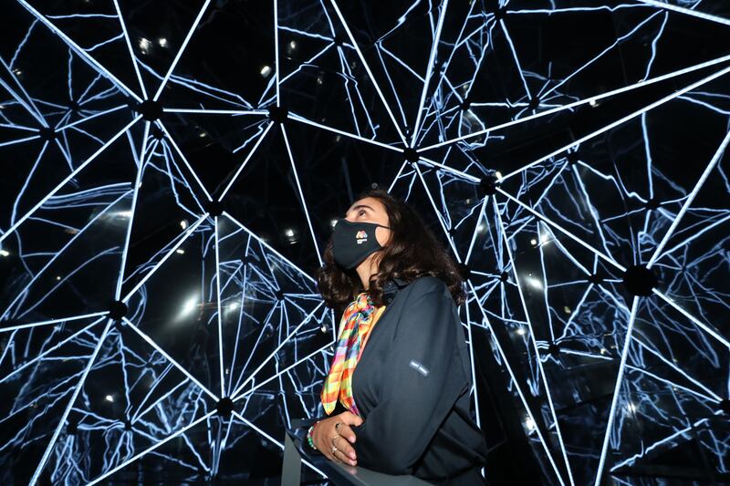 A woman is enthralled by the kaleidoscope show during a visit to the Monaco pavilion at Expo 2020 Dubai. All photos: Chris Whiteoak / The National