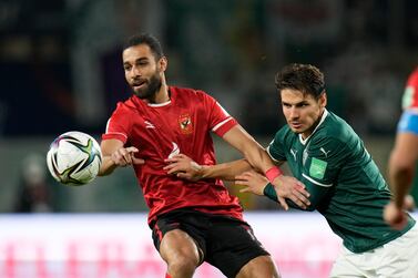 Al Ahly's Amro El Soulia, left, is challenged by Palmeiras' Raphael Veiga during the Club World Cup semifinal soccer match between Palmeiras and Al Ahly SC in Abu Dhabi, United Arab Emirates, Tuesday, Feb.  8, 2022.  (AP Photo / Hassan Ammar)