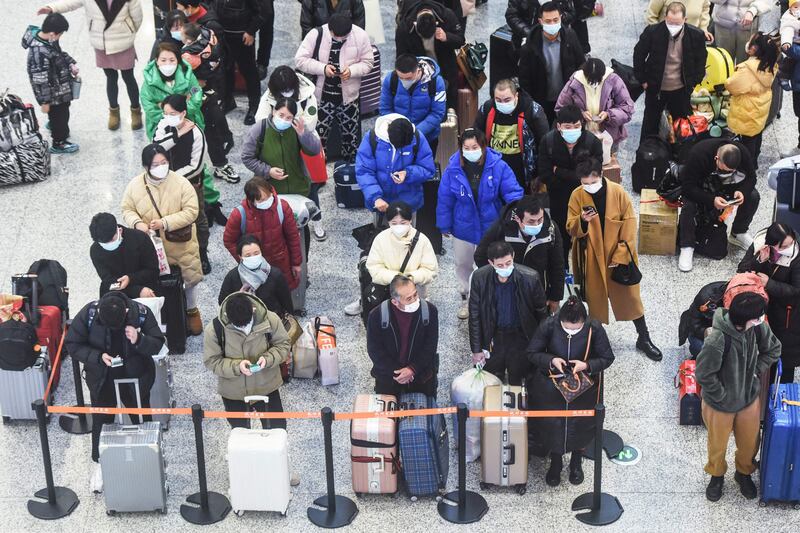 Passengers arrive at Hankou railway station in Hangzhou in China's eastern Zhejiang province. AFP
