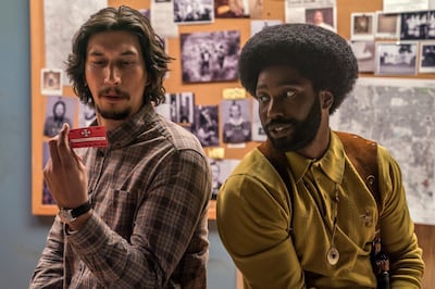 This image released by Focus Features shows Adam Driver, left, and  John David Washington in a scene from "BlacKkKlansman." (David Lee/Focus Features via AP)