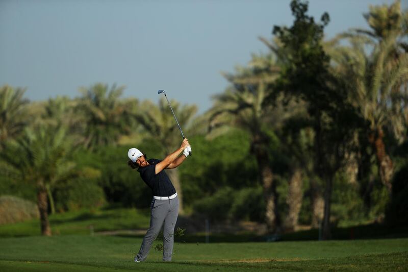 Tommy Fleetwood plays his second shot on the 14th. Getty Images