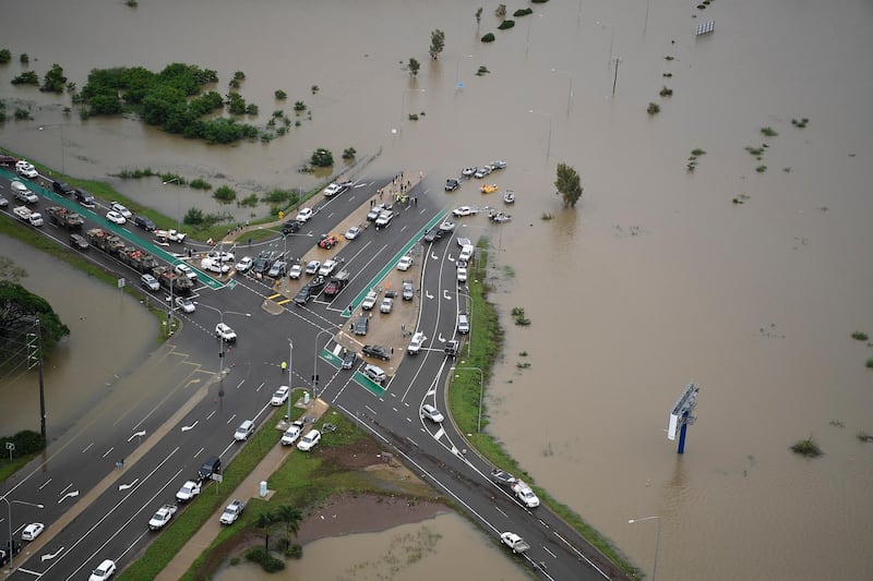A blocked major intersection in the flooded suburb of Idalia in Townsville, Australia. Getty Images