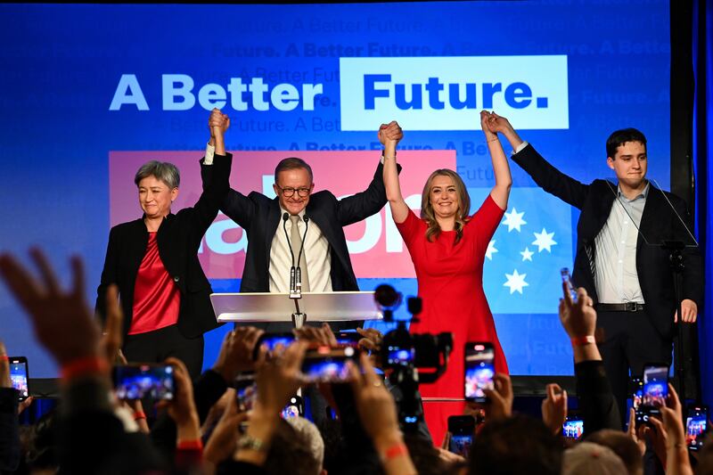 Mr Albanese (CL) is joined on stage by Shadow Minister for Foreign Affairs Penny Wong (L), his partner Jodie Haydon (CR) and son Nathan after winning the election. EPA