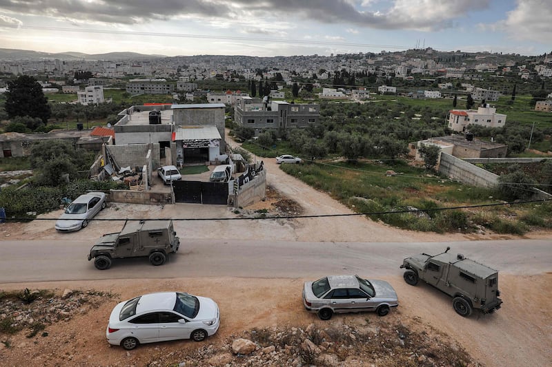 Israeli army military vehicles take part in the operation in Jenin.