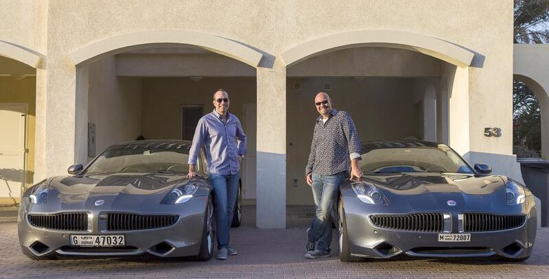 Onur Kirazci, left, and Michael Kraemer with their Fisker Karma electric cars. Photo: Antonie Robertson/The National