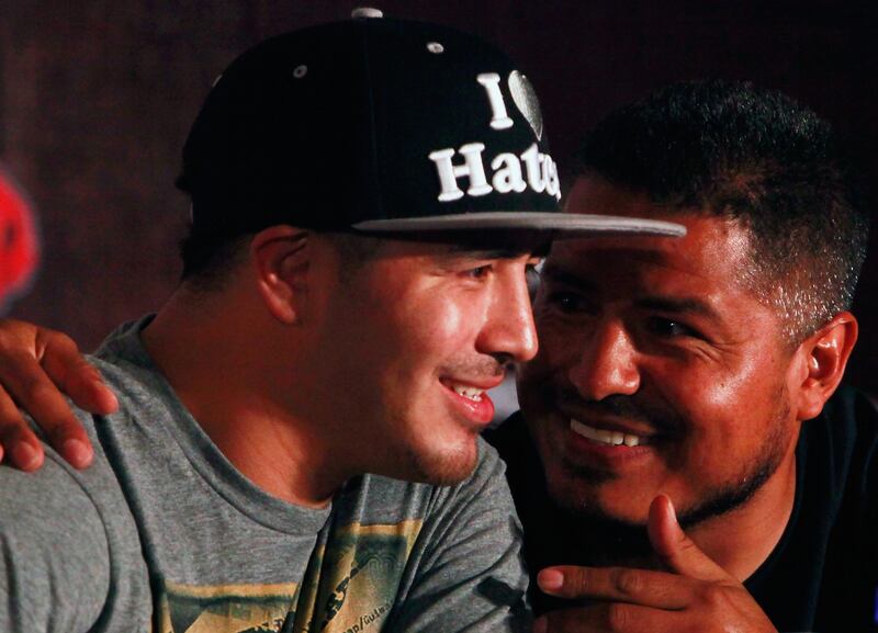 SHANGHAI, CHINA - JULY 31:  Brandon Rios (L) and his coach Robert Garcia chat at a press conference on July 31, 2013 in Shanghai, China.  (Photo by Kevin Lee/Getty Images) *** Local Caption ***  175071968.jpg