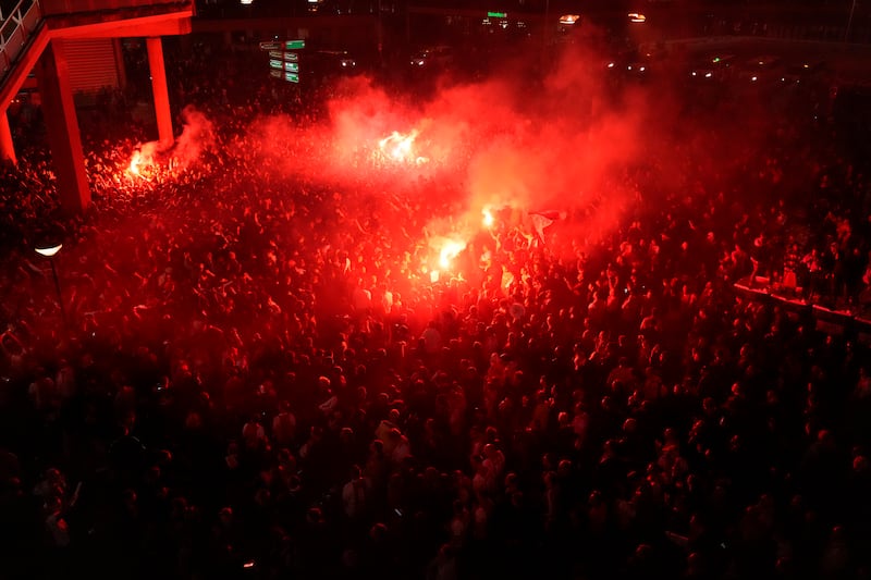 Fans celebrate outside the Johan Cruyff Arena after Ajax won the Dutch league title on Wednesday. AP