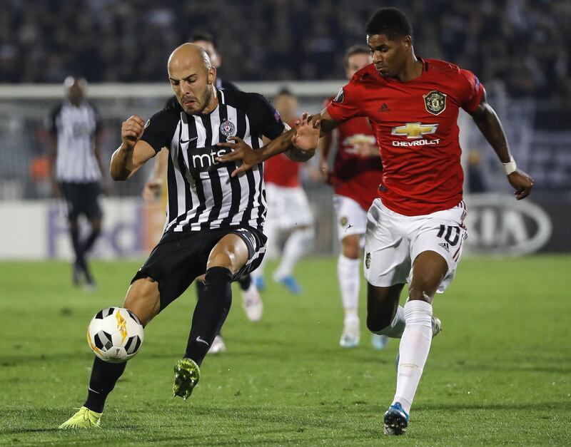Nemanja Miletic, left, is challenged by Marcus Rashford at the Partizan Stadium in Belgrade. Getty Images