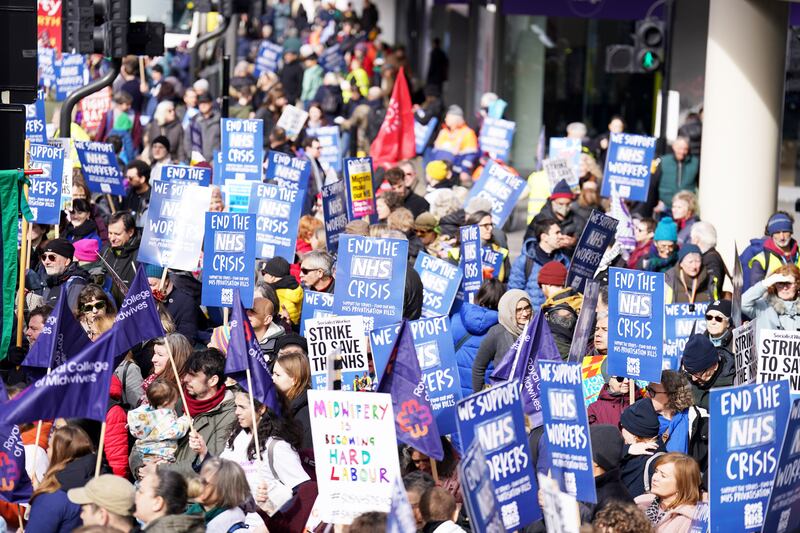 People gather in London ahead of a Support the Strikes march in solidarity with nurses, junior doctors and other NHS staff following recent industrial action. PA