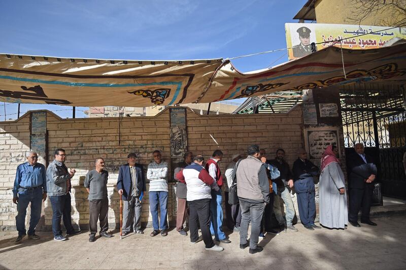 Egyptian voters queue up outside a polling station before the start of the first day of the 2018 presidential elections, in al-Haram neighbourhood in the capital Cairo's southwestern Giza district on March 26, 2018. Mohamed El-Shahed / AFP