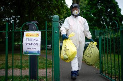 LEICESTER, ENGLAND - JUNE 29: A city council worker carries rubbish from a coronavirus testing centre at Spinney Park which will be incinerated on June 29, 2020 in Leicester, England. In a television appearance on Sunday, British Home Secretary Priti Patel confirmed the government was considering a local lockdown after a spike in coronavirus cases in the city. The city's mayor has said that Pubs and restaurants in Leicester may stay closed for two more weeks due to a recent surge in coronavirus cases. (Photo by Christopher Furlong/Getty Images)