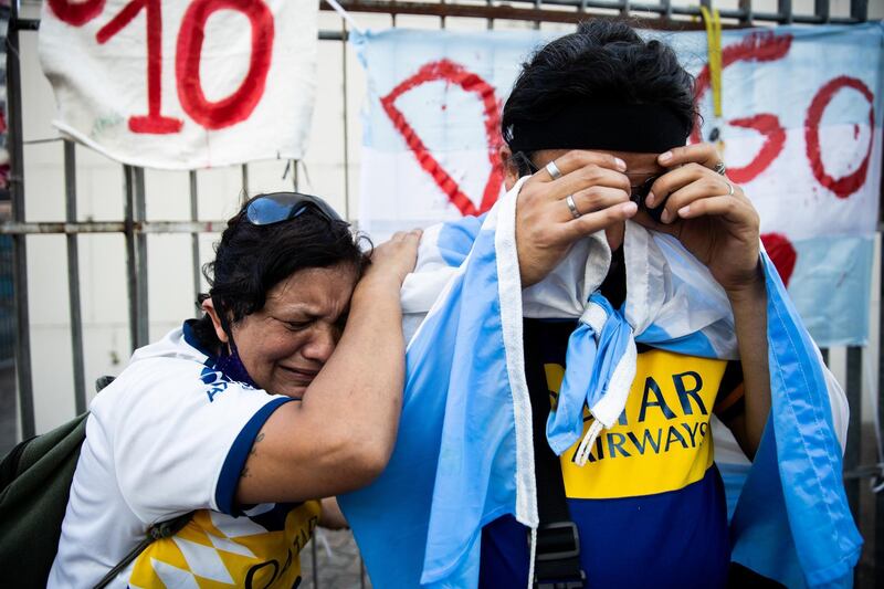 Fans cry for Maradona after the news of his death, Getty