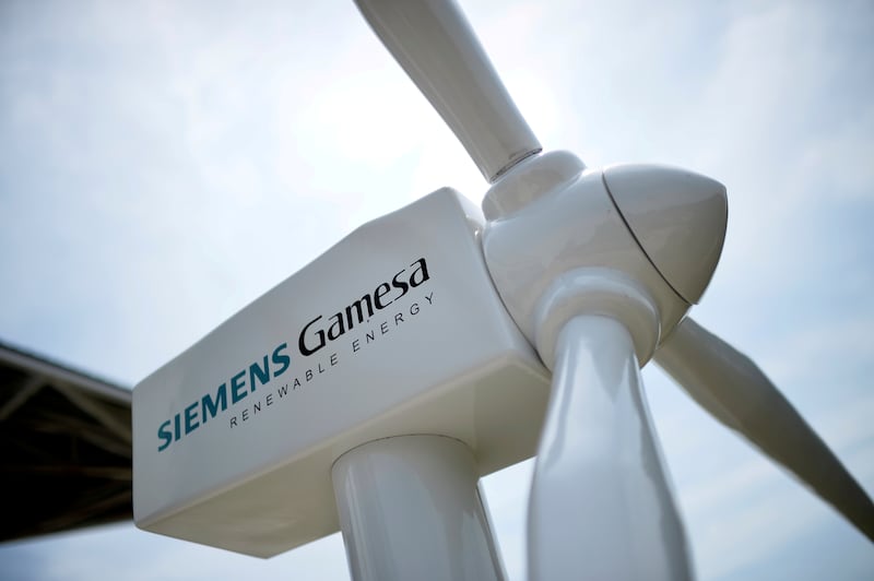 A model of a wind turbine with the Siemens Gamesa logo is displayed outside the annual general shareholders meeting in Zamudio, Spain. Reuters