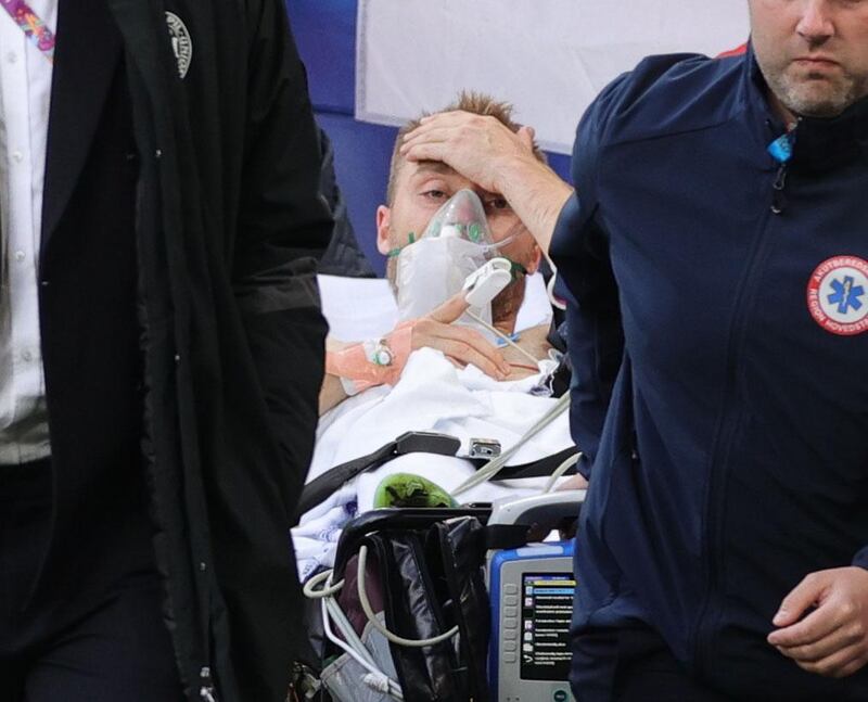 Soccer Football - Euro 2020 - Group B - Denmark v Finland - Parken Stadium, Copenhagen, Denmark - June 12, 2021 Denmark's Christian Eriksen is carried off after collapsing during the match Pool via REUTERS/Friedemann Vogel