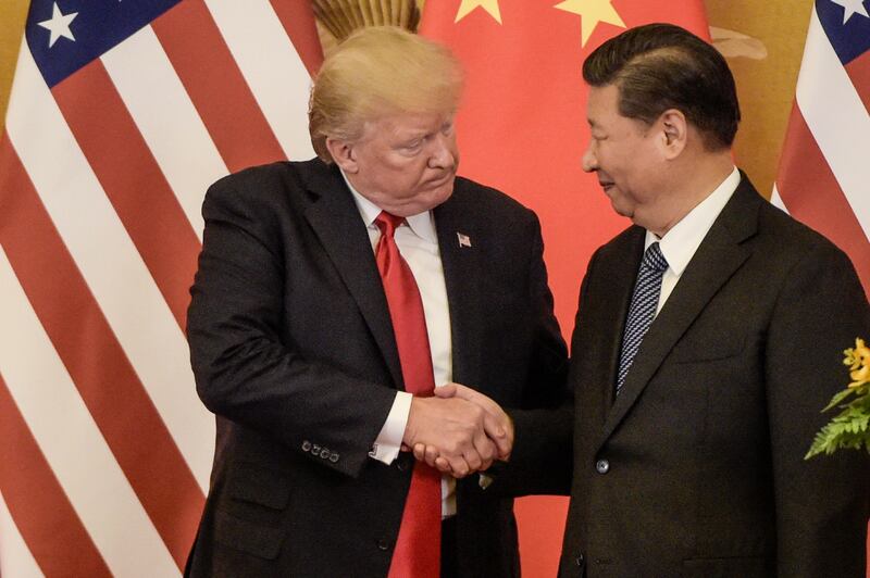 TOPSHOT - US President Donald Trump (L) shakes hand with China's President Xi Jinping at the end of a press conference at the Great Hall of the People in Beijing on November 9, 2017.
Donald Trump and Xi Jinping put their professed friendship to the test on November 9 as the least popular US president in decades and the newly empowered Chinese leader met for tough talks on trade and North Korea. / AFP PHOTO / Fred DUFOUR