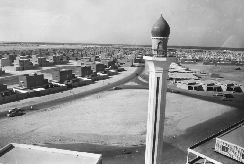 A mosque and rows of identical square houses in Isa Town, as the new town nears completion in 1968.