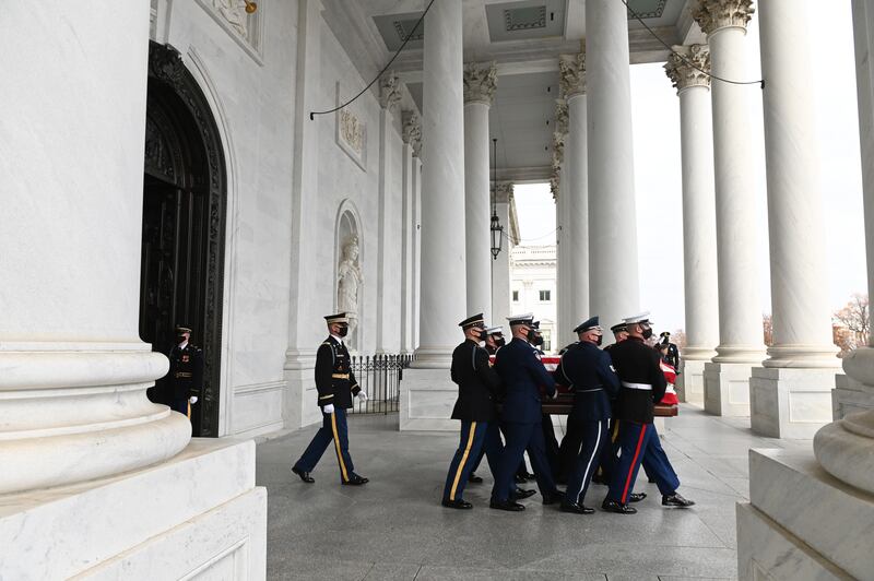 The casket is led out of the US Capitol building before the funeral in Washington. EPA