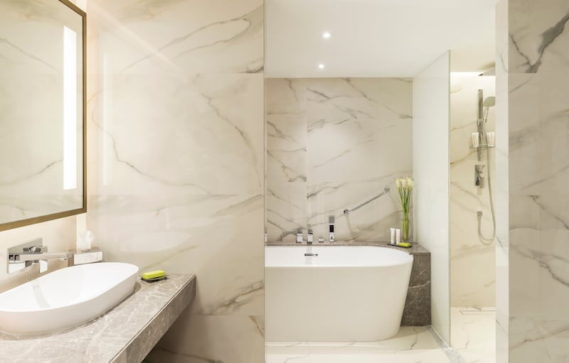 The marbled, gold-plated bathroom in the Classic Deluxe Suite