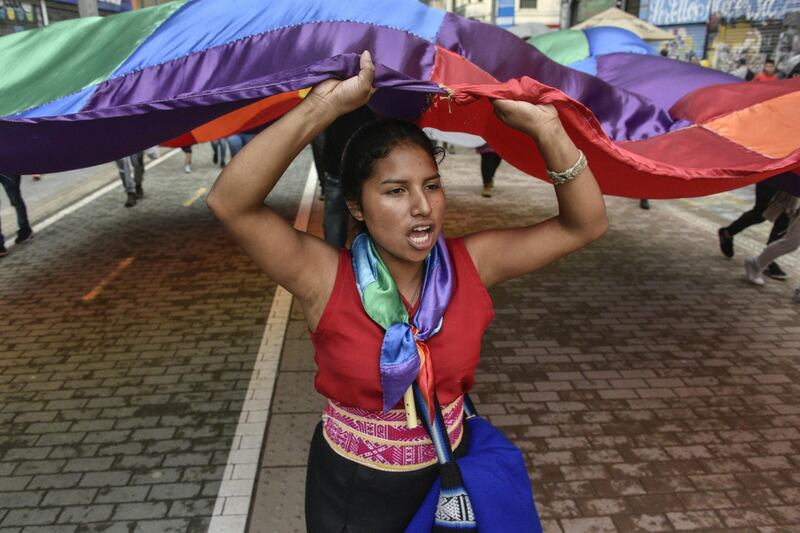A indigenous woman marches holding a Wiphala flag during anti-government protests against the politics of President Ivan Duque on the eighth consecutive day in Bogota, Colombia. Getty Images