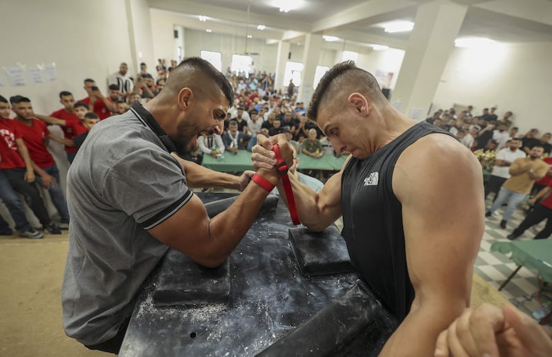 Palestinians take part in a two-day arm wrestling championship in Rammun village, east of Ramallah, in the West Bank.