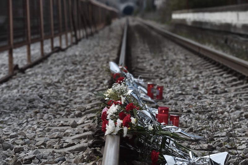 Flowers for the victims of Greece's worst train accident lie on the tracks of the Rapsani railway station in the country's north on March 5. AFP