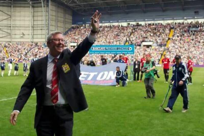 Manchester United’s Sir Alex Ferguson salutes the fans before the match against West Brom. Eddie Keogh / Reuters