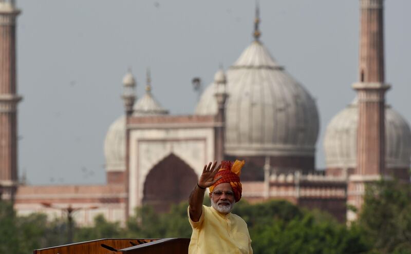 Indian Prime Minister Narendra Modi gestures to the crowd after delivering his speech for the country's 71st Independence Day celebrations, which marks the 70th anniversary of the end of British colonial rule, at the historic Red Fort in New Delhi on August 15, 2017.
India can defend itself from anyone who seeks "to act against our country", Prime Minister Narendra Modi said in an Independence Day speech August 15 amid a tense standoff with Beijing over a Himalayan plateau.
 / AFP PHOTO / MONEY SHARMA