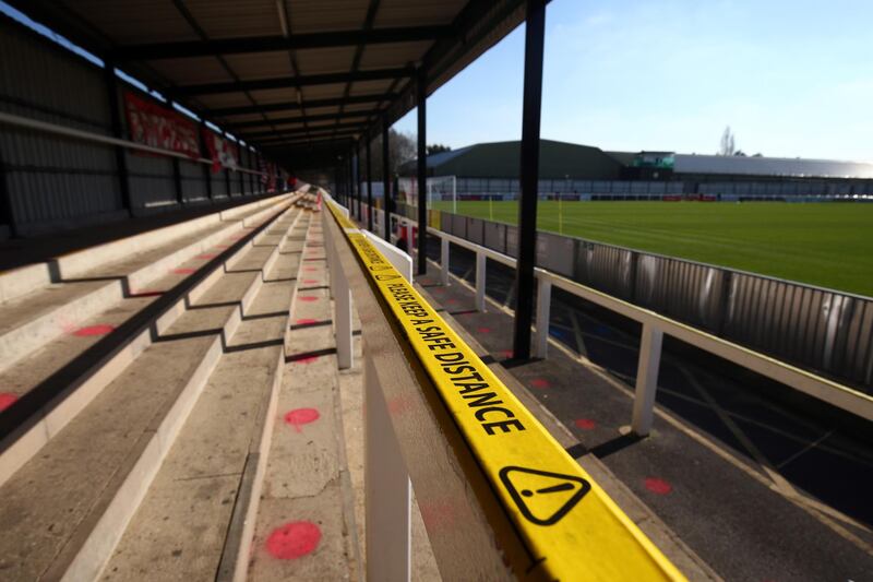 Kingfield Stadium featuring florescent dots to aid social distancing prior to the FA Trophy match between Woking FC and Torquay United at Kingfield Stadium in Woking, England.  Getty Images