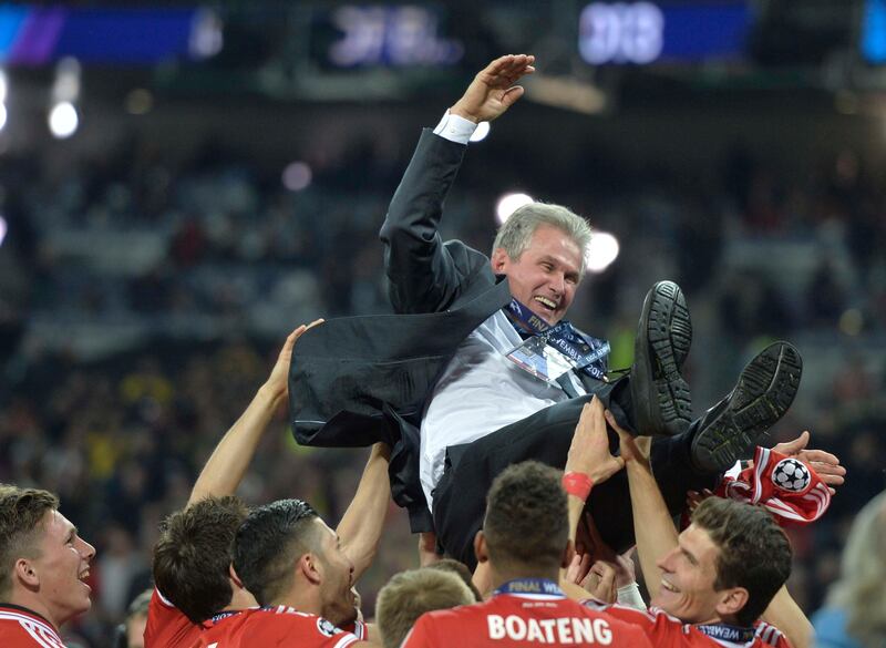 FILE - In this May 25, 2013 file photo then Bayern Munich head coach Jupp Heynckes is thrown in the air by his players after winning the Champions League Final soccer match against Borussia Dortmund at Wembley Stadium in London. (AP Photo/Martin Meissner)