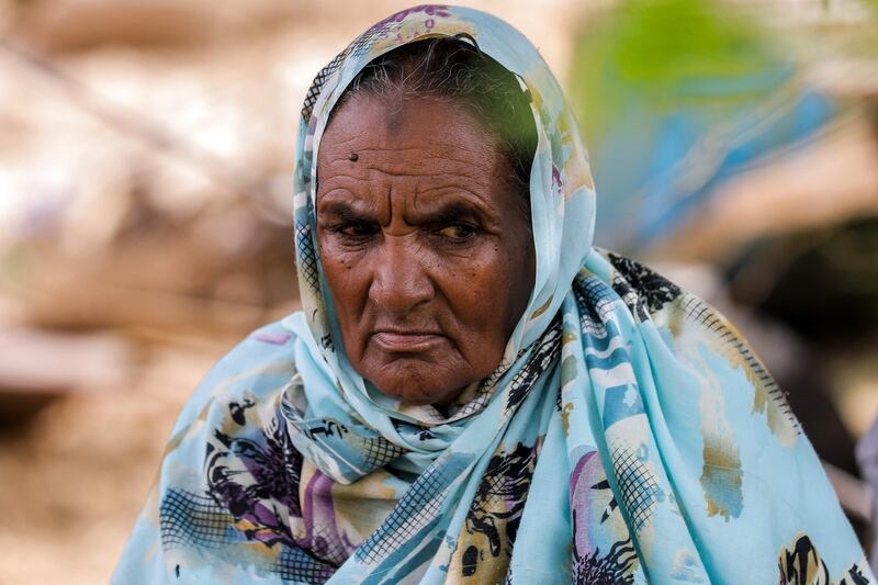 An elderly woman displaced by floods in Makaylab. AFP