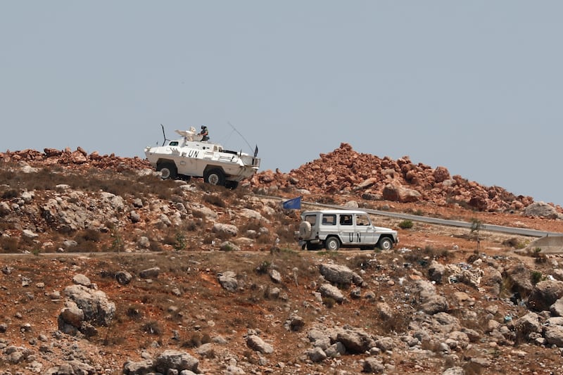UN peacekeeping troops patrol the Lebanese side of the border with Israel, as seen from the Israeli village of Metula.