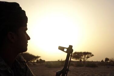 A fighter loyal to the Saudi-backed Yemen government holds a position near the frontline facing Iran-backed Houthi rebels in the country's north-eastern Marib province. Riyadh and Tehran are holding talks to reduce regional tensions. AFP