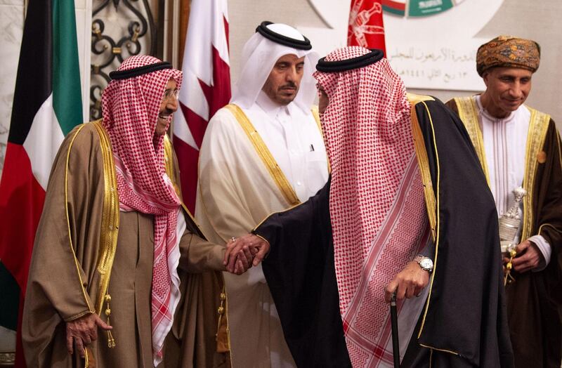 King Salman bin Abdulaziz of Saudi Arabia shakes hands with Kuwaiti Emir Sheikh Sabah Al-Ahmad Al-Jaber Al-Sabah, as Qatar's Prime Minister Abdullah bin Nasser bin Khalifa al-Thani and Omani Deputy Prime Minister Fahd bin Mahmud al-Said look on. AFP