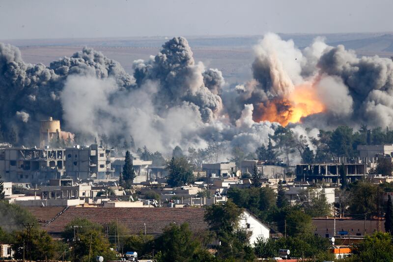 October 18, 2014: Smoke rises over Syrian town of Kobani after an air strike. Three days prior, Washington launched a campaign called Operation Inherent Resolve. Over the next year, the US military conducts more than 8,000 air strikes in Iraq and Syria. Reuters