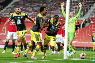 Southampton's Michael Obafemi, 20, celebrates after scoring his team's second goal during the English Premier League soccer match between Manchester United and Southampton at Old Trafford in Manchester, England, Monday, July 13, 2020. (AP Photo/Dave Thompson,Pool)