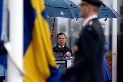 Swedish Prime Minister Ulf Kristersson speaks at a flag-raising ceremony for his country's accession to Nato in Brussels, on March 11. 
 AFP