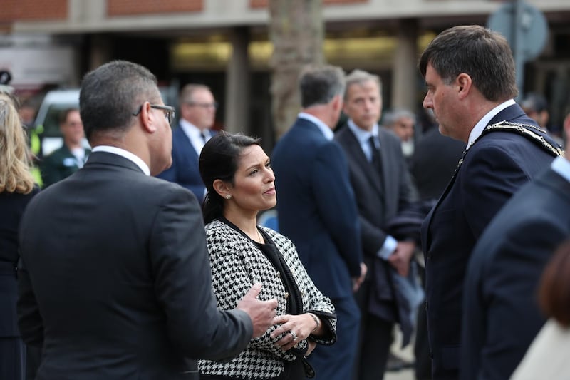 Business Secretary Alok Sharma, Home Secretary Priti Patel and Mayor of Reading, Cllr David Stevens (right) speak together following a vigil for the victims of the Reading terror attack, at Market Place on June 27, 2020 in Reading, United Kingdom. Getty Images