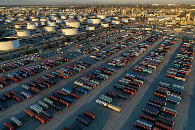 Shipping containers and storage tanks at a Los Angeles refinery. Oil prices eased for a third day in a row on Friday. Reuters
