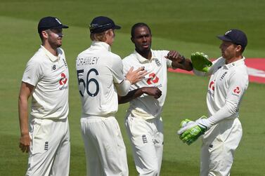 England's Jofra Archer (2nd R) celebrates with teammates after taking the wicket of West Indies' Roston Chase for 37 on the fifth day of the first Test cricket match between England and the West Indies at the Ageas Bowl in Southampton, southwest England on July 12, 2020. West Indies were set a target of 200 to beat England in the first Test at Southampton on Sunday's fifth and final day. - RESTRICTED TO EDITORIAL USE. NO ASSOCIATION WITH DIRECT COMPETITOR OF SPONSOR, PARTNER, OR SUPPLIER OF THE ECB / AFP / POOL / Mike Hewitt / RESTRICTED TO EDITORIAL USE. NO ASSOCIATION WITH DIRECT COMPETITOR OF SPONSOR, PARTNER, OR SUPPLIER OF THE ECB